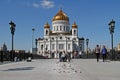 Worker mounts illumination on the Patriarch`s bridge in front of the Cathedral of Christ the Saviour in Moscow