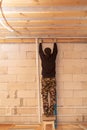 Worker mounts a profile on a wall at a construction site