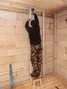 Worker mounts a profile on a wall at a construction site