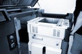Worker moves working camera of 3D printer into 3D printer. Industrial 3D printer