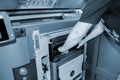 Worker moves working camera of 3D printer into 3D printer. Industrial 3D printer