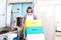 Worker moving beehives