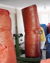 Worker moving large sack full of coca leaves at the Coca Leaves Depot in Chulumani