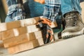 Worker Moving Wood Beams Close Up