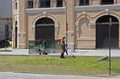 Worker mowing lawn in public square in Rio de Janeiro, Brazil Royalty Free Stock Photo