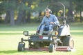 Worker mowing the park