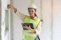 Worker occupation. Woman inspector / architect checking interior material process in house reconstruction project Royalty Free Stock Photo