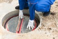 Worker opens the plastic cover of the communications hatch