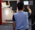 Worker operate CNC machine