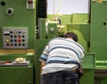 Worker operate CNC machine