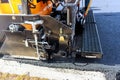 Asphalt paving machine working on road construction project Royalty Free Stock Photo