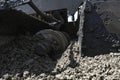 Worker operating asphalt paver machine during road construction and repairing works. A paver finisher, asphalt finisher Royalty Free Stock Photo