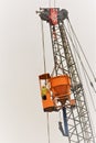 worker operating a concrete bucket on a crane