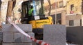 Madrid, Spain January 03 2023: worker operating excavator machine on street ground Royalty Free Stock Photo