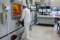 Worker operating in factory for treatment of hard radioactive waste at Chernobyl nuclear power plant. Ukraine. 02- 2015