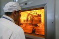 Worker operating in factory for treatment of hard radioactive waste at Chernobyl nuclear power plant. Ukraine. 02- 2015