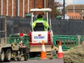 A worker operating a Forklift truck on road works