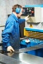 Worker operating guillotine shears