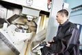 Worker operating metal machining center