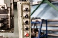 A worker is operating remote swtich to control overhead crane at the factory warehouse. Industrial working action photo. Close-up Royalty Free Stock Photo