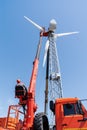 Worker operator of the aerial platform at the workplace. Installation of a wind generator