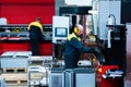 Worker operator bending metal sheet process by sheet bending machine for bus manufactuing part, steel folding with Royalty Free Stock Photo