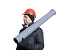 Worker in an orange helmet with sewer pipe in his hand Royalty Free Stock Photo