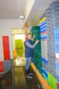 Worker organising stacks plastic containers