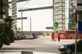 Worker in overalls sweeps sidewalk with a broom Royalty Free Stock Photo