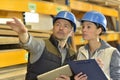 Worker with overseer controling stock Royalty Free Stock Photo