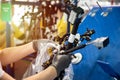 Worker is packing a wiring harnesses, production line, workflow. Automobile industry, manufacturing Royalty Free Stock Photo