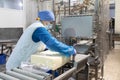 Worker packs butter at the dairy plant