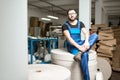 Worker at the paper tubes manufacturing Royalty Free Stock Photo