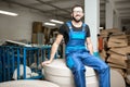 Worker at the paper tubes manufacturing