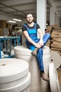 Worker at the paper tubes manufacturing