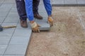 Worker paving new sidewalk