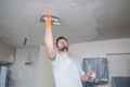 Worker plastering ceiling Royalty Free Stock Photo