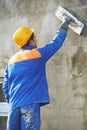 Worker at plastering facade work Royalty Free Stock Photo