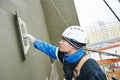 Worker at plastering facade work Royalty Free Stock Photo