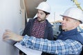 Worker at plastering facade work