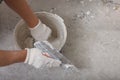 Worker plastering wall with putty knife indoors, closeup Royalty Free Stock Photo