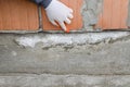 Worker points at waterproofing membrane, protective layer against moisture Royalty Free Stock Photo