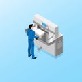 The worker of the polygraphic center carries out duties of the operator of a cutting machine