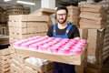 Worker portrait with paper tubes