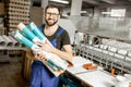 Worker portrait with paper tubes