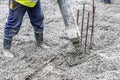 Worker pouring cement and concrete with pump tube Royalty Free Stock Photo