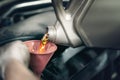 Worker pours new synthetic motor oil from canister into car engine at service Royalty Free Stock Photo