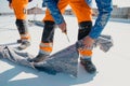 Worker prepares geotextile for the roof, covers it with synthetic PVC membrane