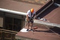 Madrid, Spain - September, 04, 2019: work at height. Worker with harness for dangerous work