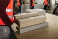 A worker prepares PVC furniture boards for packaging